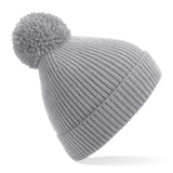 Engineered knit ribbed pom pom beanie